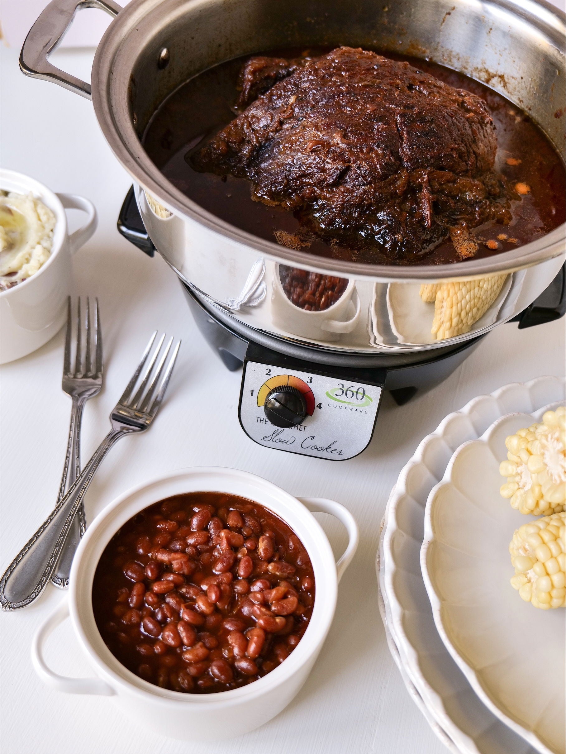 Slow cooker brisket with baked beans and corn on the side