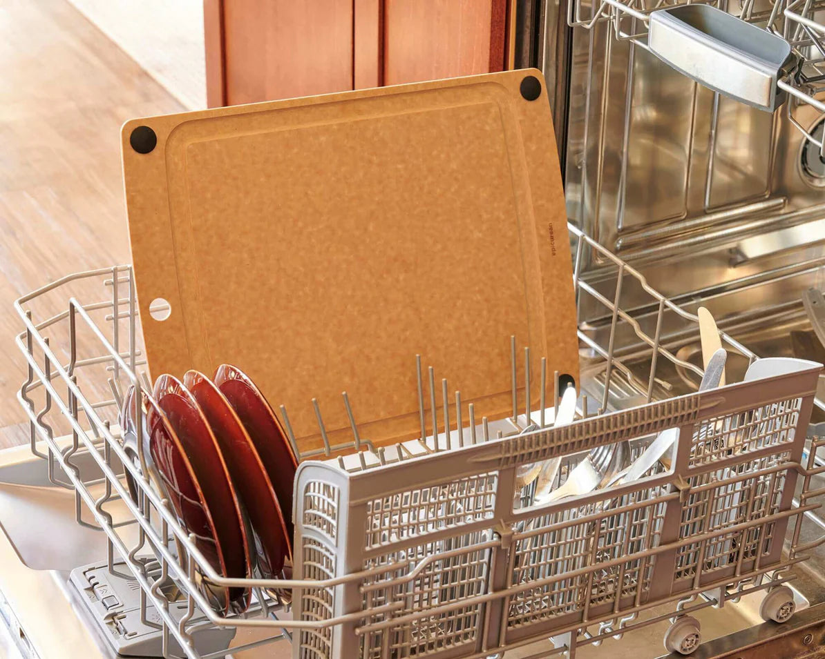 All-In-One Series Cutting Board placed in a dishwasher with dishes and utensils