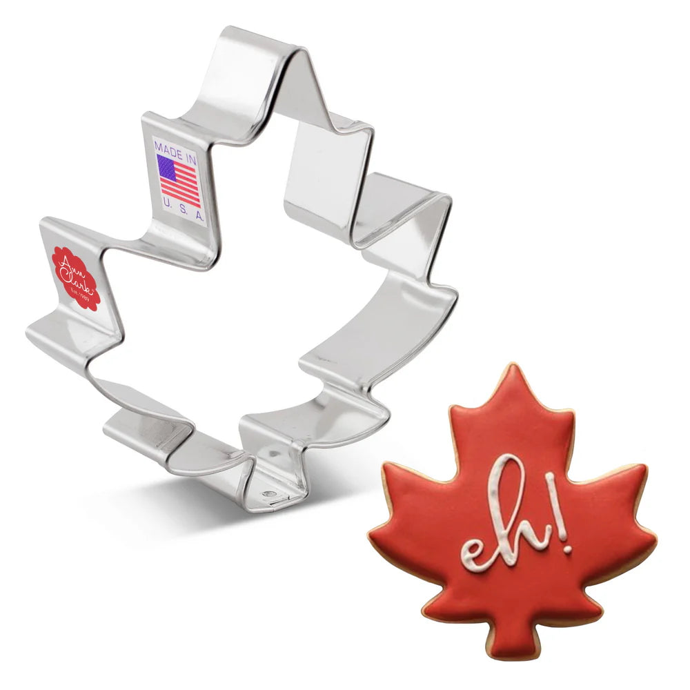 Maple leaf cookie cutter and cookie with 'eh!' text