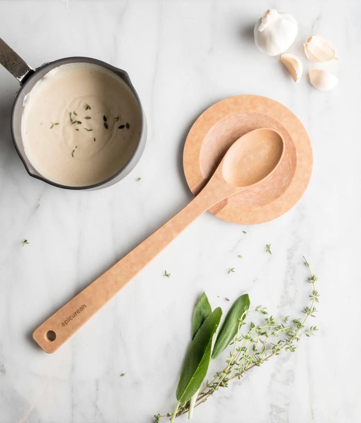 Epicurean cooking spoon on a round rest
