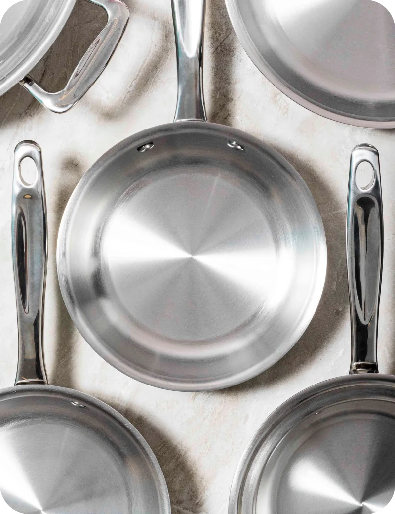 Set of 360cookware stainless steel cookware on a light background
