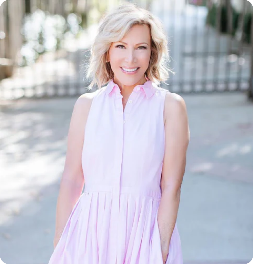 Kym Douglas smiling in a pink dress, influencer for 360cookware