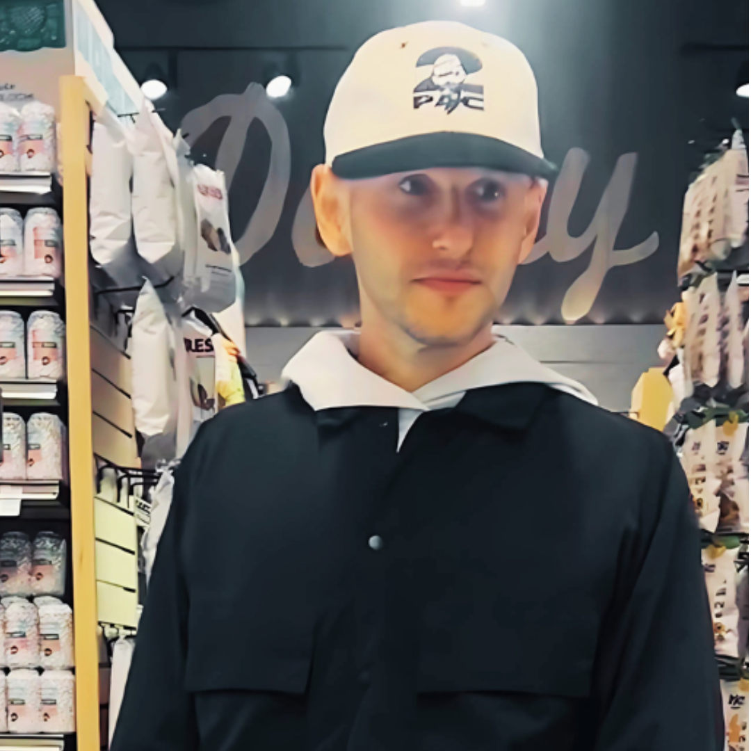 The Health Goat wearing a cap in a store setting