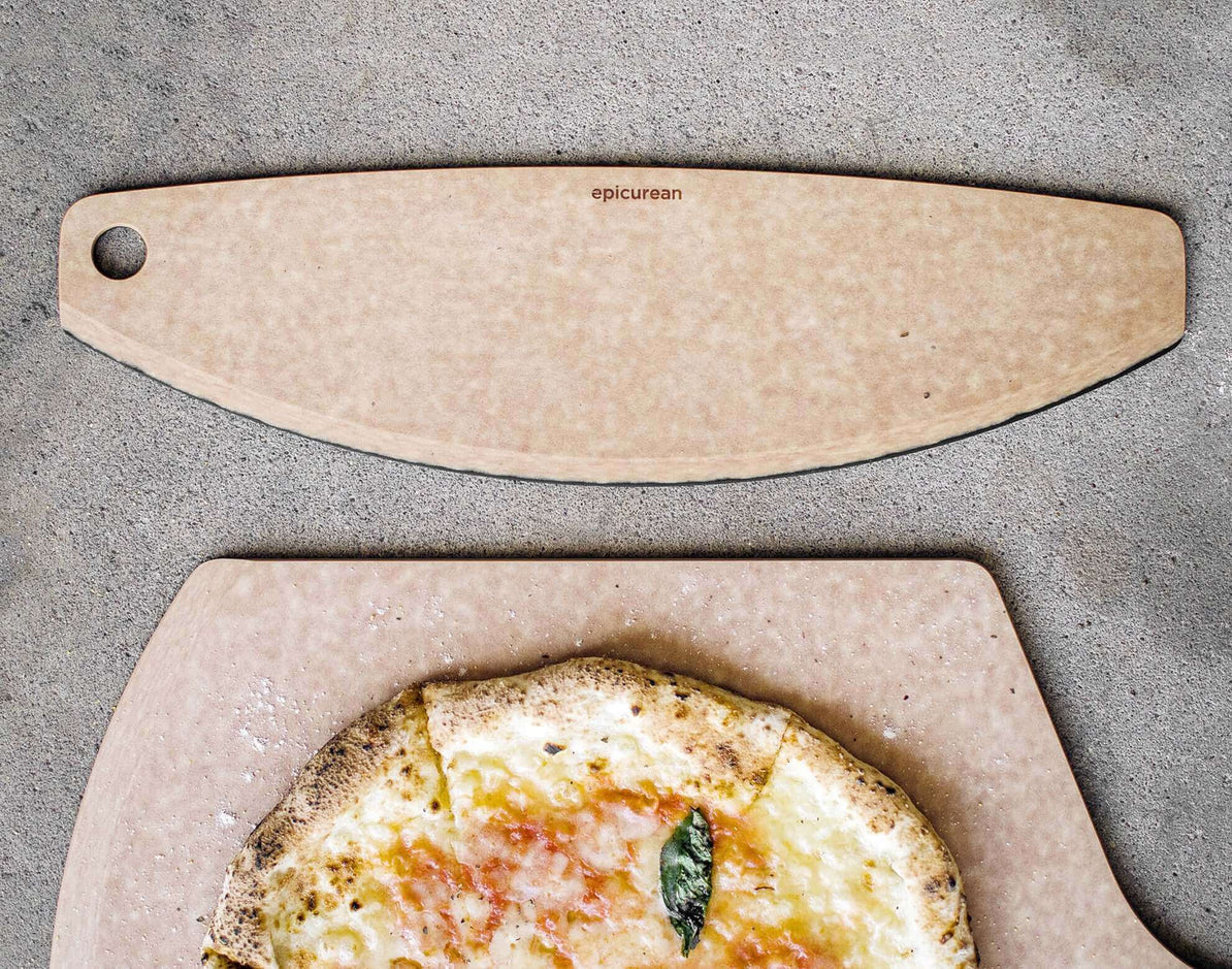 360cookware pizza cutter on a countertop with a pizza.