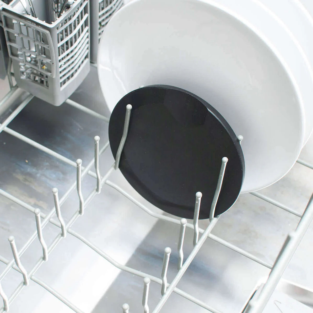 Slate round tool rest in dishwasher, showcasing its dishwasher-safe feature.