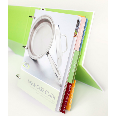 Open cookbook with tabs labeled 'USE & CARE GUIDE', 'SOFT STEEL', 'STAINLESS STEEL', and 'APPLIANCES'.
