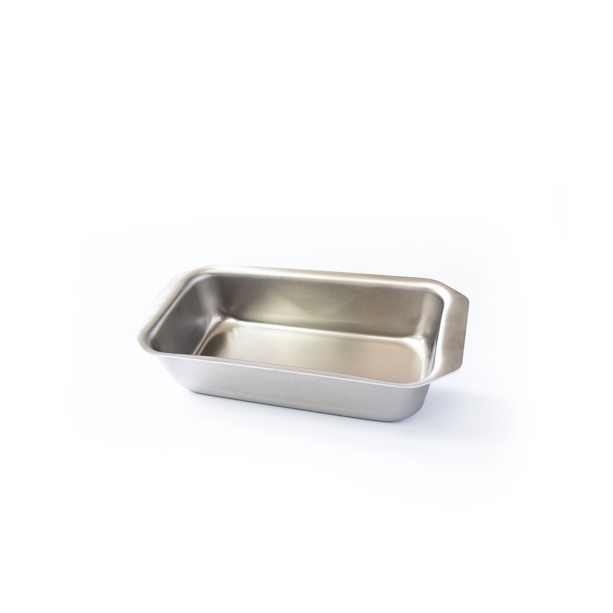 Stainless steel loaf pan with tab handles, suitable for baking bread and meatloaf.