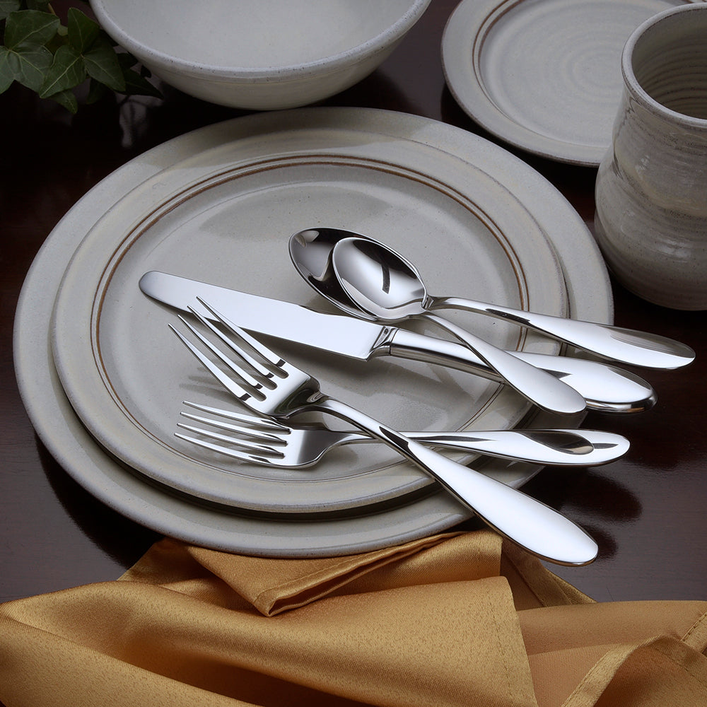 Betsy Ross 45 Piece Set displayed on a table with plates and utensils arranged elegantly.