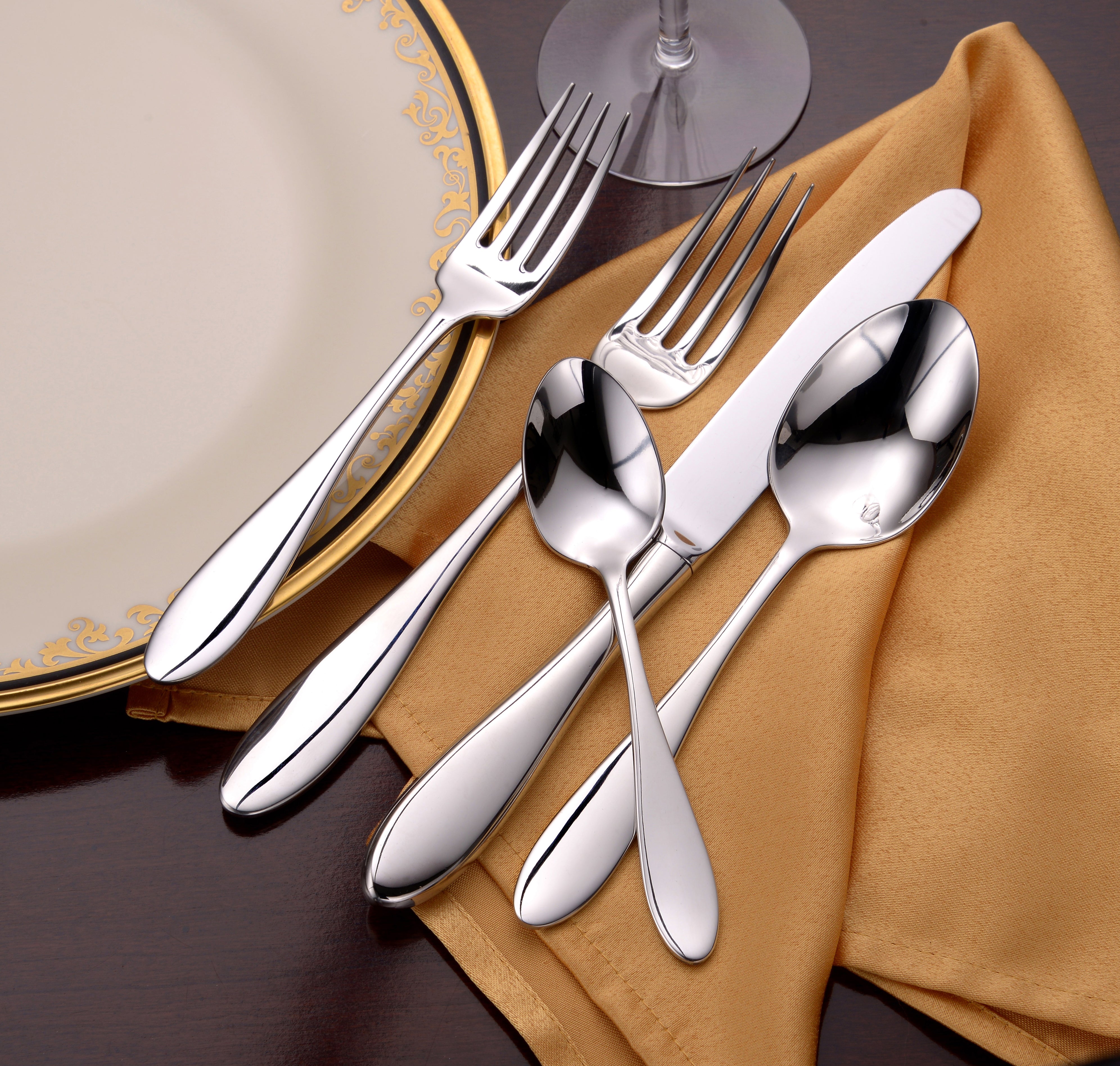 Betsy Ross 45 Piece Set featuring elegant teardrop utensils with mirror finish on a table setting