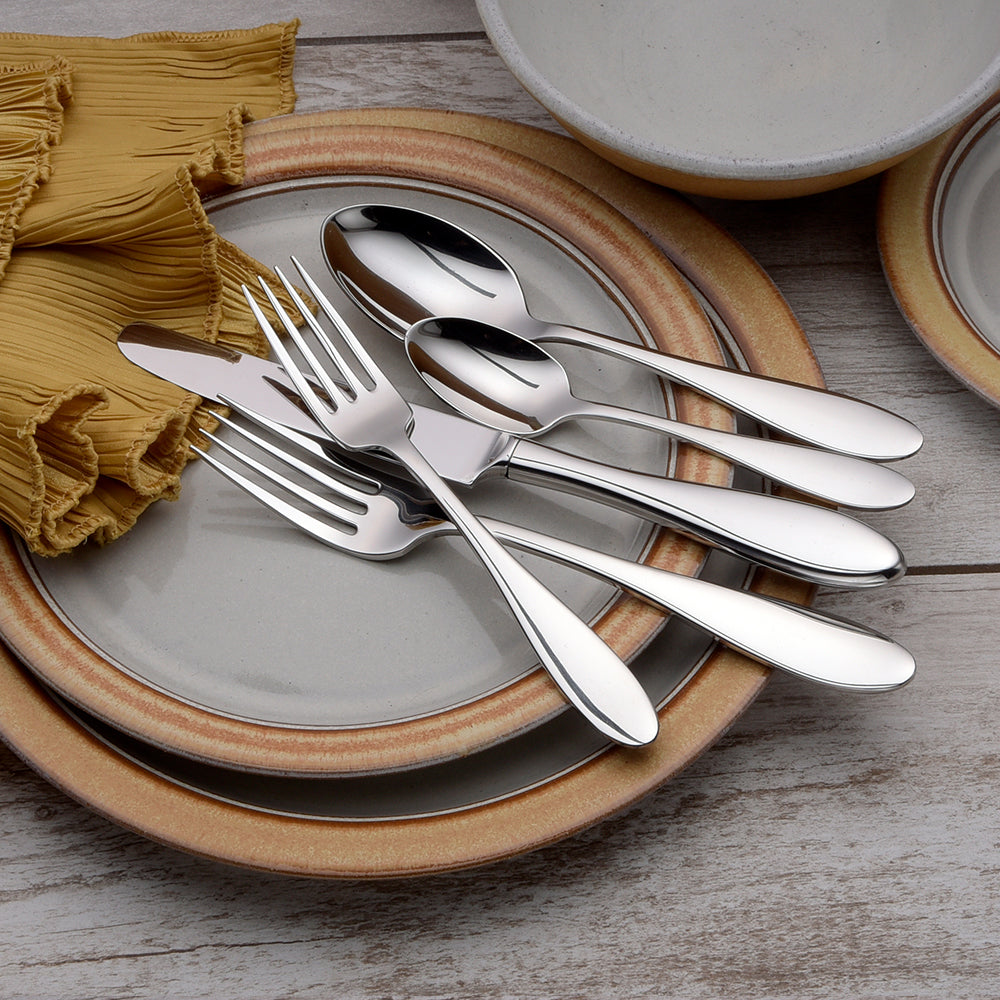 Betsy Ross 45 Piece Set displayed on plates with utensils arranged elegantly