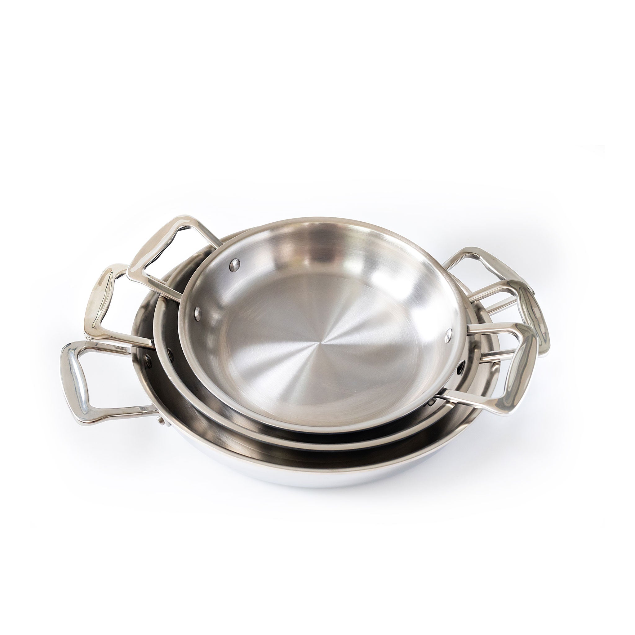 Three stainless steel fry pans stacked with short handles.