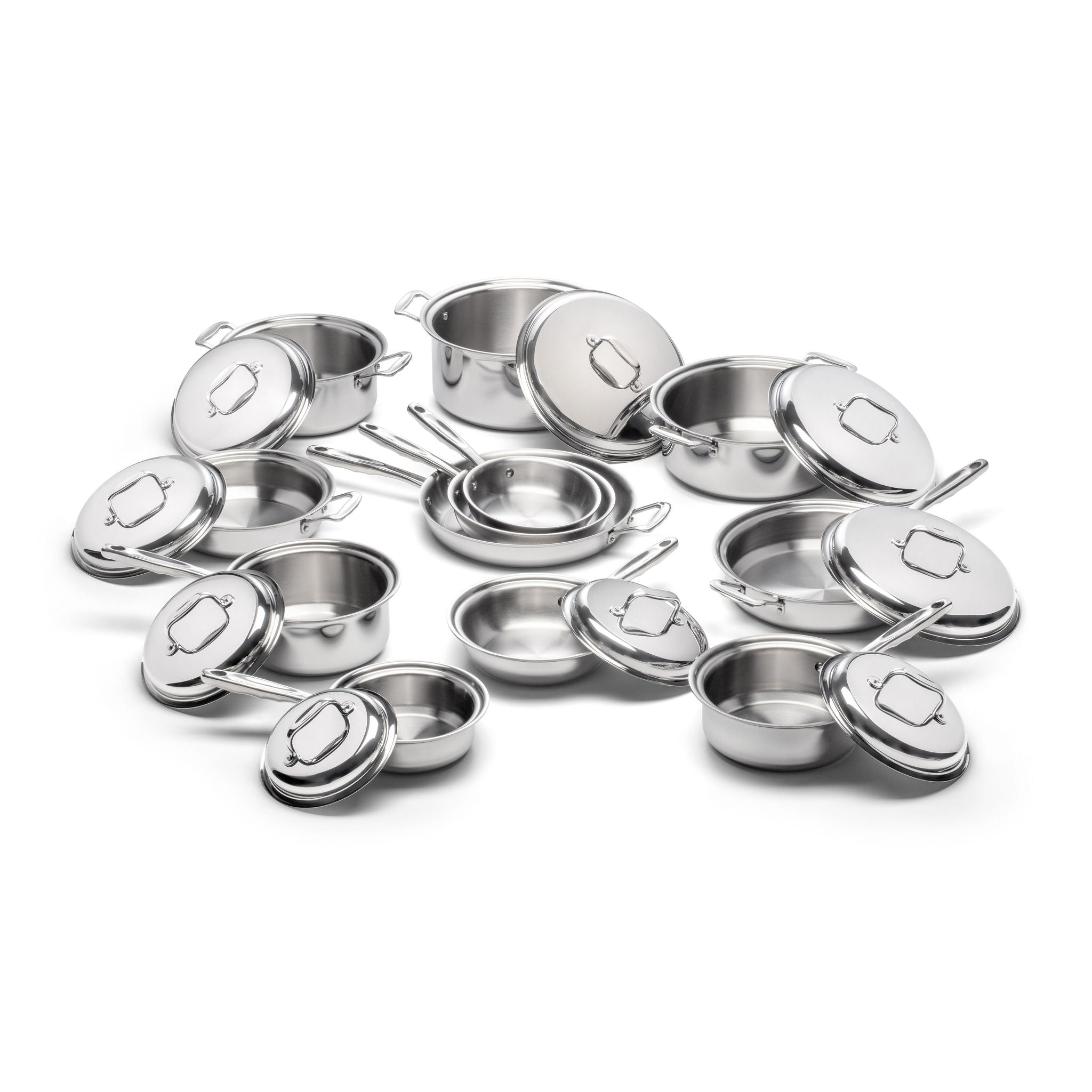 Collection of stainless steel cookware including saucepans and lids.