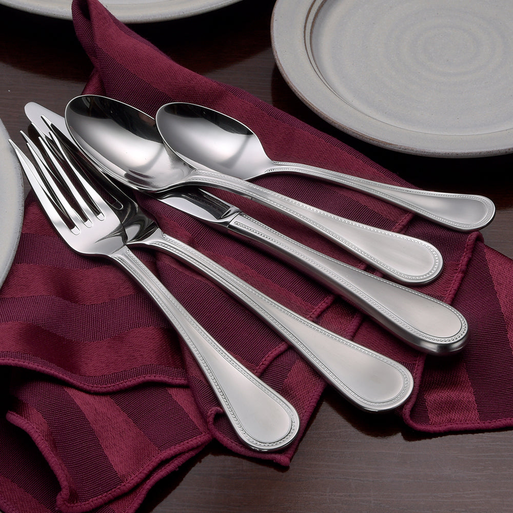 Satin Pearl 45 Piece Set displayed with utensils on a table setting