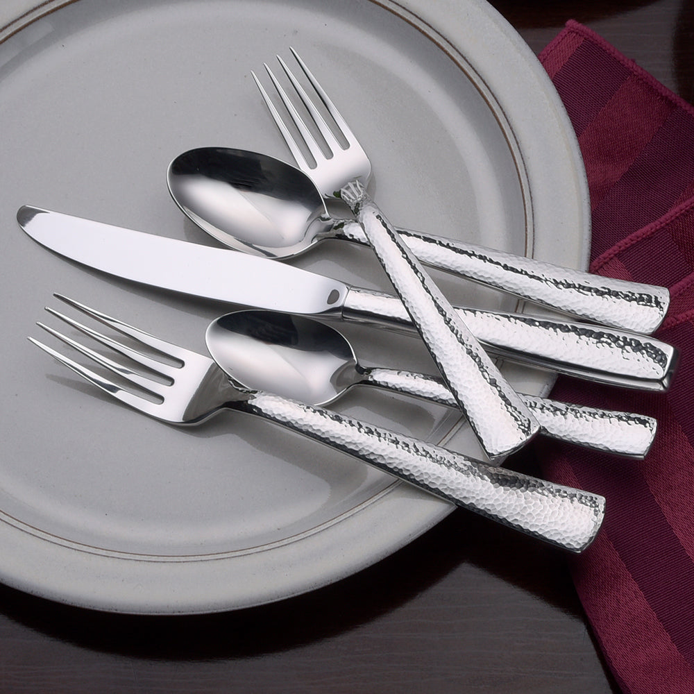 Pinehurst 45 Piece Set flatware including knife, fork, and spoon on a plate