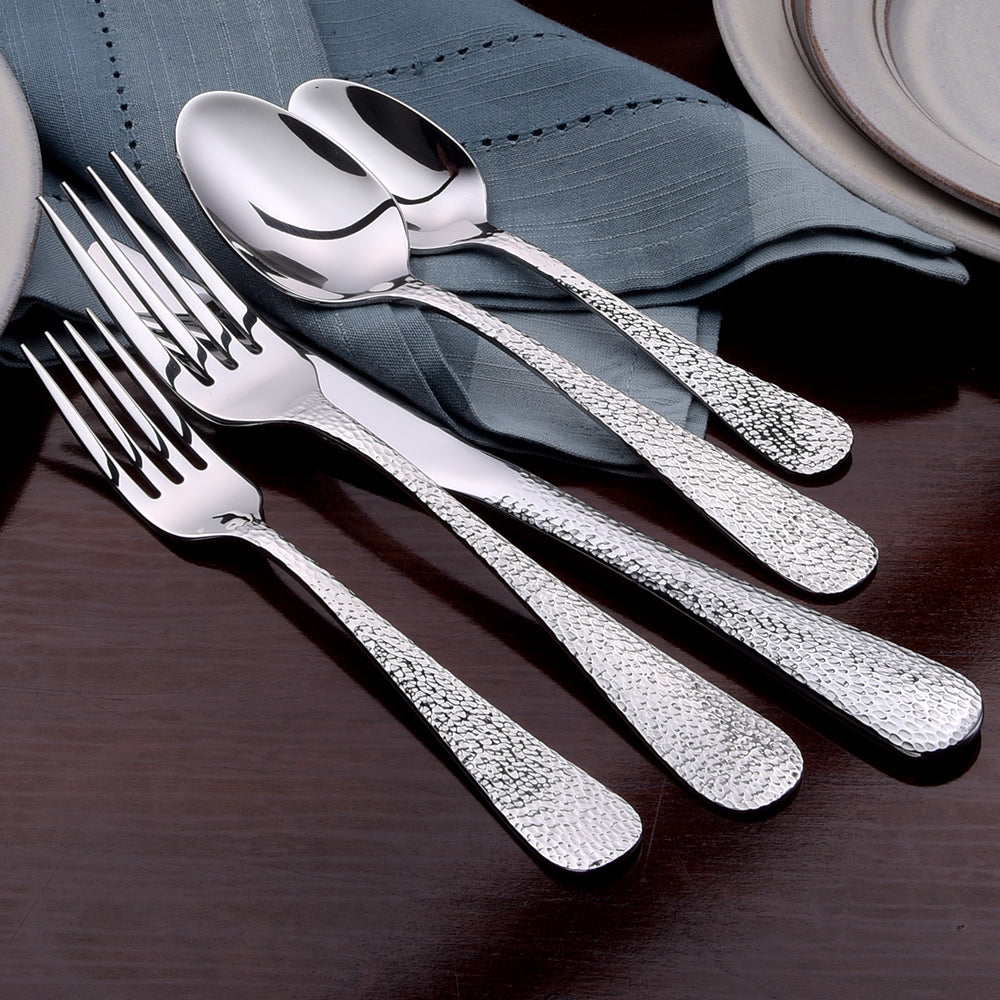 Providence 65 Piece Set featuring a variety of utensils including forks and spoons on a table setting