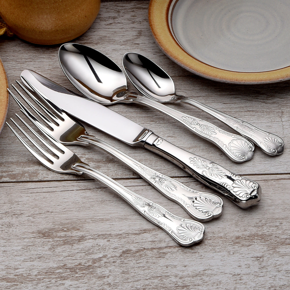 Sheffield 45 Piece Set with forks, knives, and spoons on a wooden table