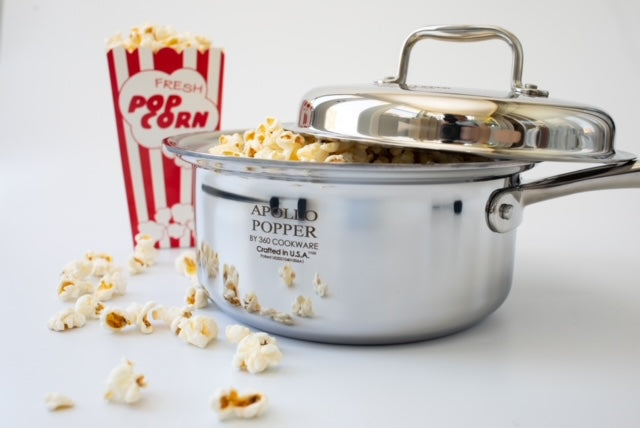 Apollo Popper by 360cookware with popped corn and popcorn box in background
